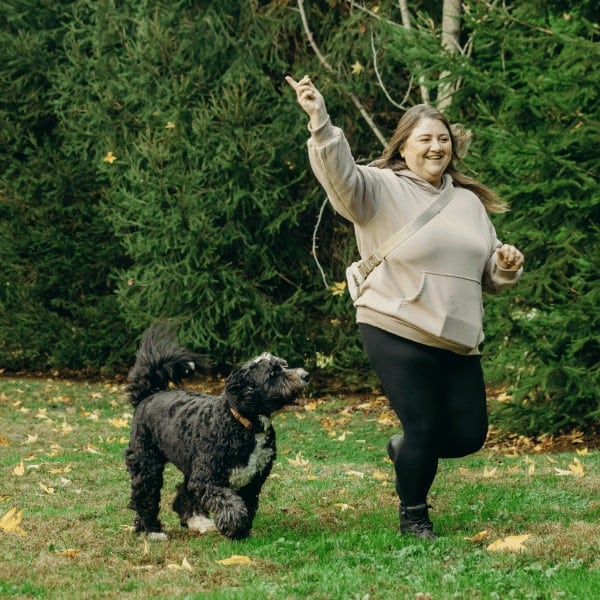 dog gone walking team member running with dog